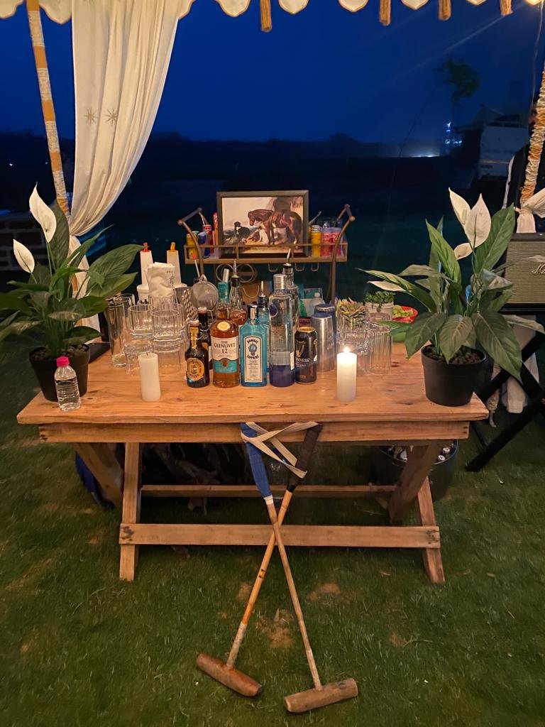 The bar laid by candlelight beneath the canopy